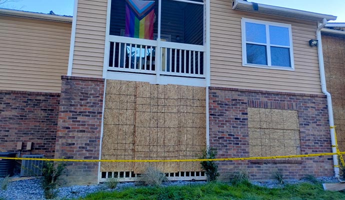 Building with boarded-up windows and doors