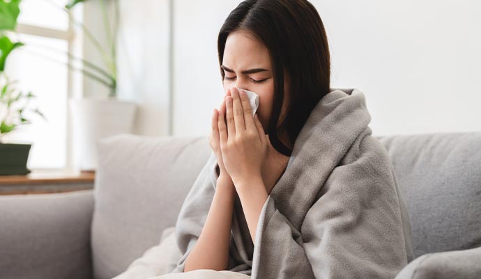 Woman experiencing discomfort due to duct issues