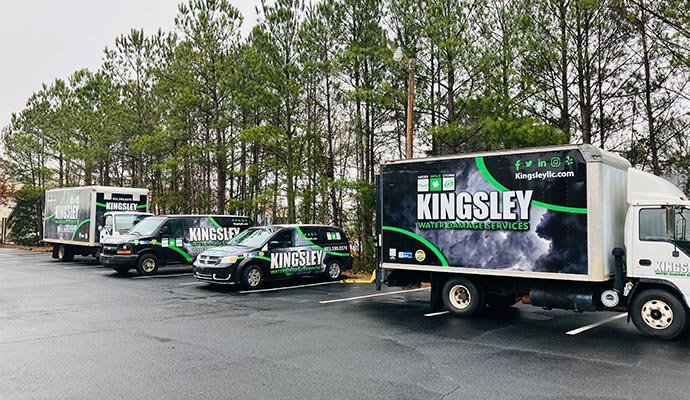 Kingsley restoration trucks parked in a row