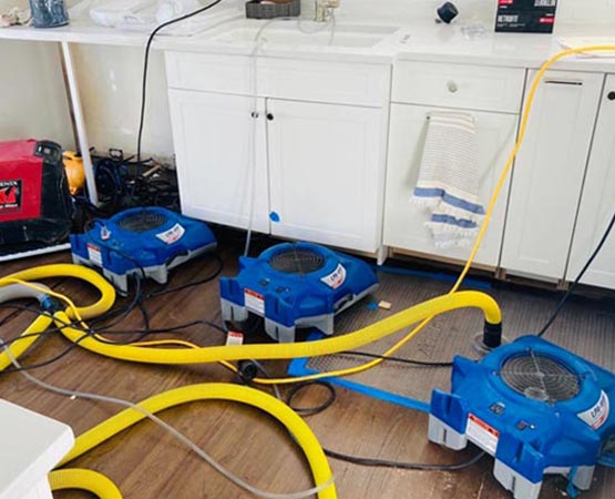 Professional drying setup for water damage restoration
