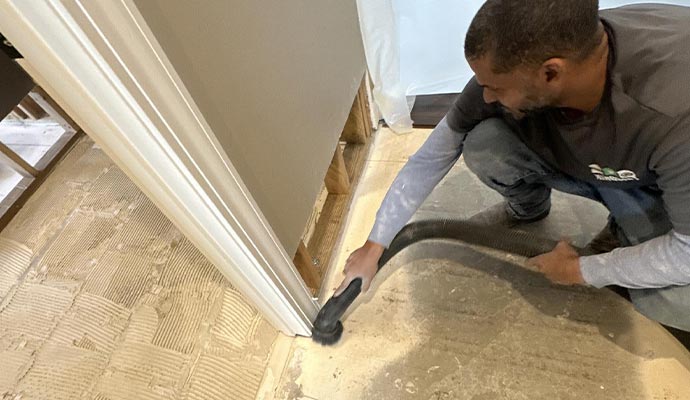 Person cleaning sewage waste on floor