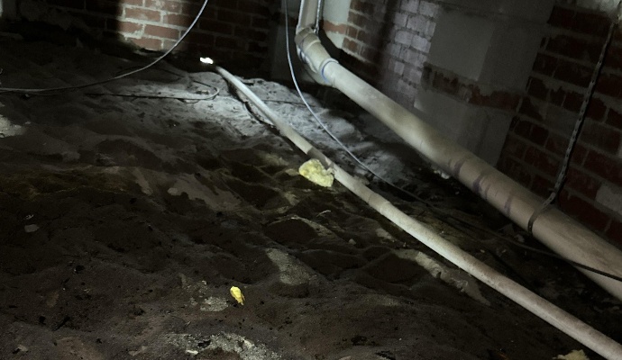 Water damaged muddy crawlspace