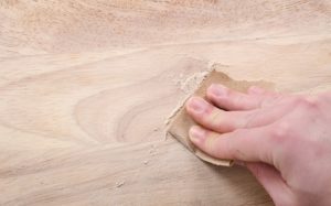 using sandpaper to repair water damaged wood furniture